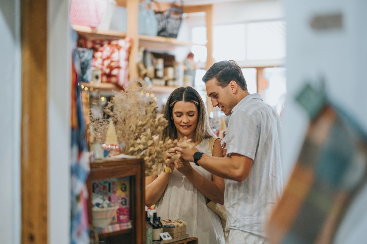 couple staring at flowers