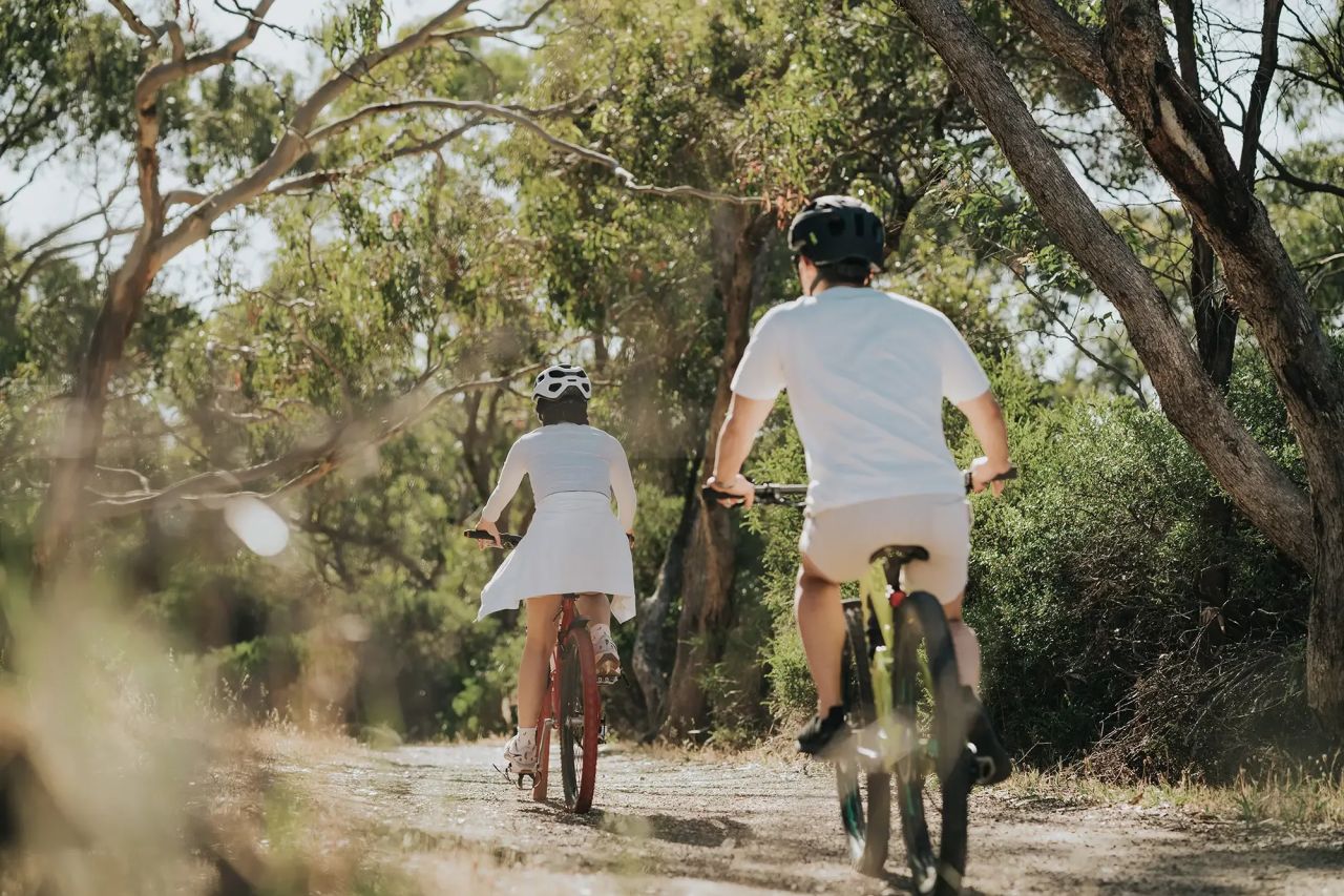 Couple riding through Onkaparinga National PArk